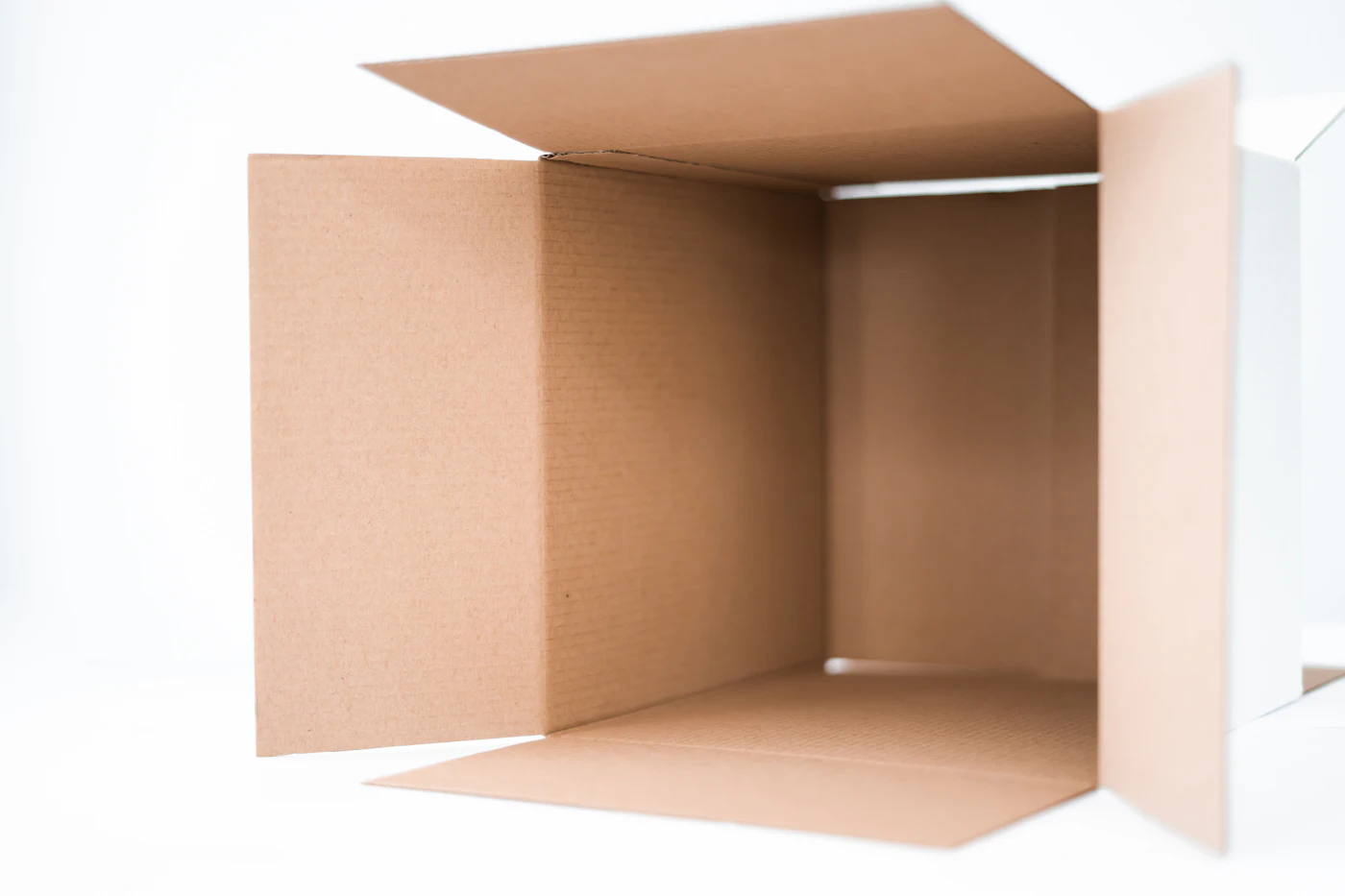 An open, empty cardboard box ready to be packed